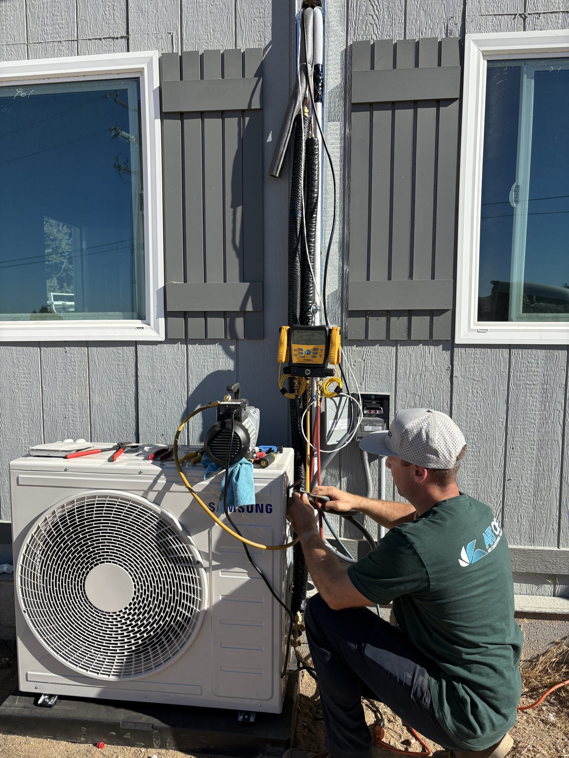 Art of Air Worker Fixing HVAC Unit in Jurupa Valley CA